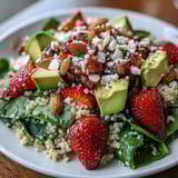 Fresh and vibrant Strawberry Avocado Quinoa Salad featuring protein-rich quinoa, basil, and a zesty lemon-honey dressing, perfect for summer.  
